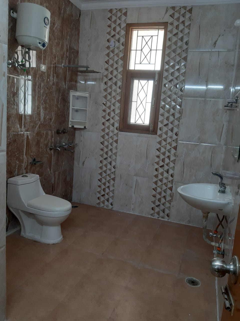 Bathroom with geyser and hot water